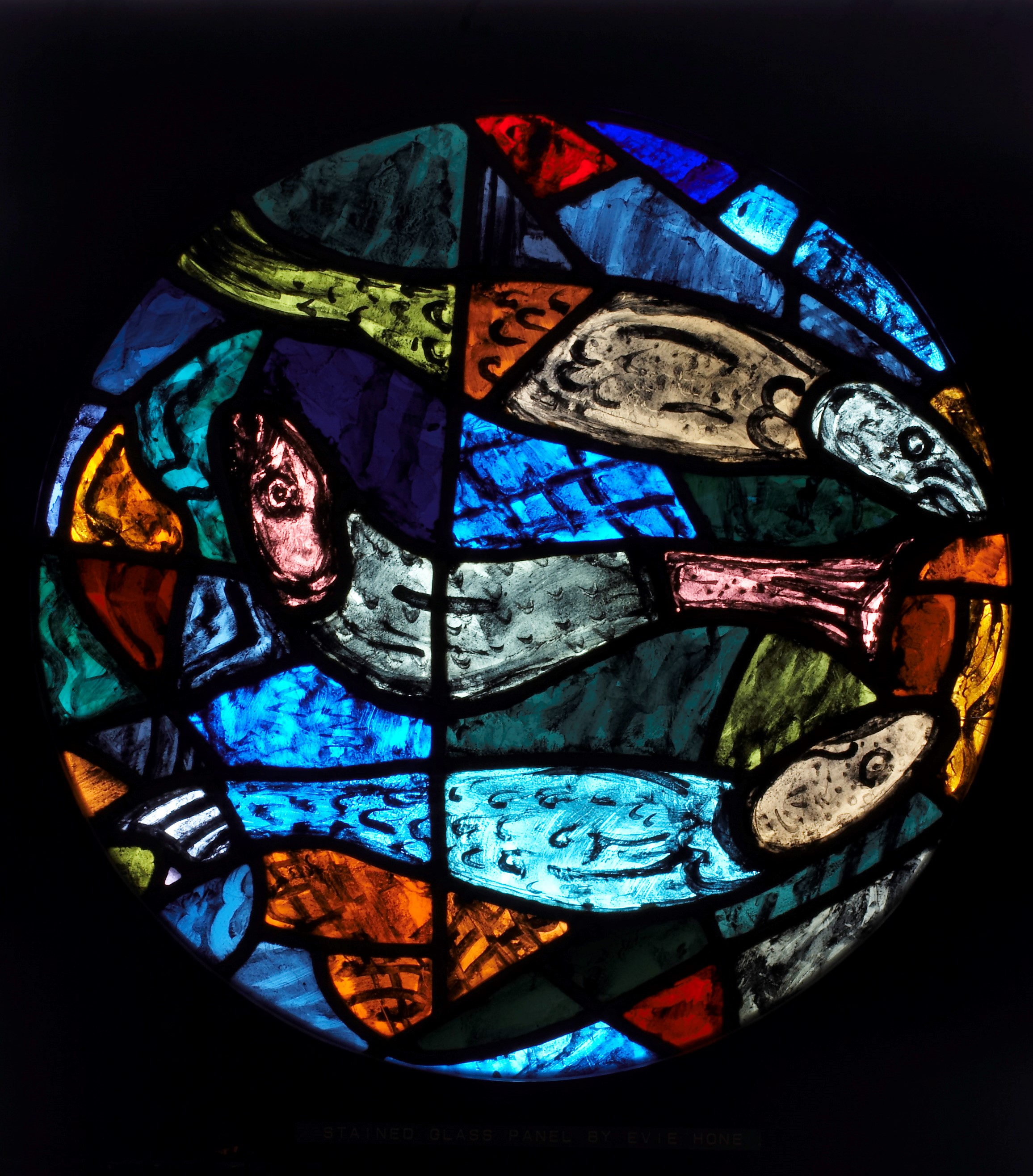 Leaded stained glass panel, oval on square